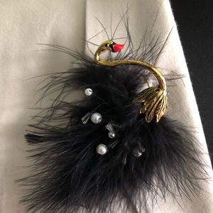 Black swan goldtone feather brooch